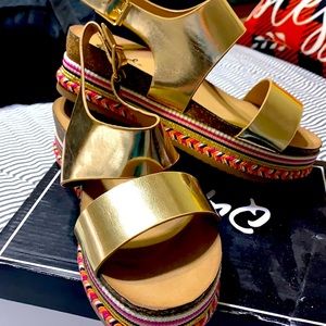 Gold sandals with platform. Brad new in the box.